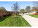 Expansive backyard featuring a well-maintained lawn and covered parking at 1228 Graystone Dr, Gastonia, NC 28054