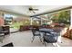 Comfortable covered patio with table, chairs, and view of the backyard at 1228 Graystone Dr, Gastonia, NC 28054