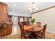 Bright dining area with a wooden table, chairs, and seamless access to the kitchen at 1228 Graystone Dr, Gastonia, NC 28054