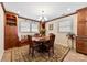 Cozy dining room with built-in shelving, comfortable seating, and a view of the outdoors at 1228 Graystone Dr, Gastonia, NC 28054