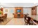 Eat-in kitchen features built-in cabinetry, wine cooler, TV, and tile flooring at 1228 Graystone Dr, Gastonia, NC 28054