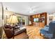 Inviting living room features hardwood floors, built-in shelving, and sliding doors to the outdoor patio at 1228 Graystone Dr, Gastonia, NC 28054