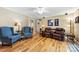 Comfortable living room features hardwood floors, natural light, and seating at 1228 Graystone Dr, Gastonia, NC 28054