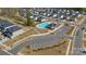 An aerial view of the community pool and parking with homes surrounding it at 126 Johns Cardinal Dr, Mooresville, NC 28115