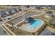 Aerial view of the community pool, showing its layout, parking, and surrounding landscaping at 126 Johns Cardinal Dr, Mooresville, NC 28115