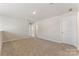 Spacious bonus room with neutral carpet and paint, perfect for a playroom or media center at 126 Johns Cardinal Dr, Mooresville, NC 28115