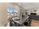 Inviting dining room with a wooden table, black chairs, and sliding glass doors to the backyard at 126 Johns Cardinal Dr, Mooresville, NC 28115