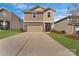 Charming two-story home with a well-manicured lawn and a spacious, two-car garage at 126 Johns Cardinal Dr, Mooresville, NC 28115