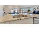 Modern kitchen with granite countertops, stainless steel sink, and views of the dining area at 126 Johns Cardinal Dr, Mooresville, NC 28115