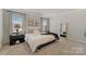 Serene main bedroom with soft carpet, neutral walls, and natural light, offering a peaceful retreat at 126 Johns Cardinal Dr, Mooresville, NC 28115