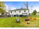 Expansive, fenced backyard featuring a fire pit, chairs, trampoline and walkout basement at 1301 Jackson St, Kannapolis, NC 28083