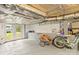 Unfinished basement features a utility sink, washer hookups, and walkout access to yard at 1301 Jackson St, Kannapolis, NC 28083