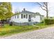 Classic home with black shutters on a well-maintained lawn, near neighborhood streets and sidewalks at 1301 Jackson St, Kannapolis, NC 28083