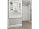 Hallway with built-in shelves displaying decorative items and a neutral color scheme at 1301 Jackson St, Kannapolis, NC 28083