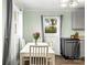Bright kitchen dining area with large windows and fresh flowers, creating a warm atmosphere at 1301 Jackson St, Kannapolis, NC 28083