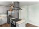 Contemporary kitchen showcases stainless steel appliances, an island cooktop, and plenty of counter space at 1301 Jackson St, Kannapolis, NC 28083