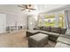 Spacious living room with comfortable seating, plush carpet, and built-in storage, ideal for relaxation at 1301 Jackson St, Kannapolis, NC 28083
