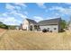 View of homes featuring outdoor living spaces and spacious backyards at 1774 Slippery Rock Ln, Monroe, NC 28112