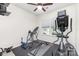 Home exercise room with rubber flooring, bright windows, and exercise machines at 1774 Slippery Rock Ln, Monroe, NC 28112