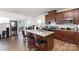 Modern kitchen island with granite countertops, stainless steel appliances, and bar stool seating at 1774 Slippery Rock Ln, Monroe, NC 28112