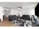 Cozy living room with a modern ceiling fan, perfect for Gathering gatherings at 1774 Slippery Rock Ln, Monroe, NC 28112