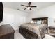 Comfortable main bedroom features a ceiling fan, large bed and two windows with curtains at 1774 Slippery Rock Ln, Monroe, NC 28112