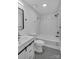 Modern bathroom with white subway tiles, black fixtures, and a sleek vanity for a clean aesthetic at 1814 Eastway Dr, Charlotte, NC 28205