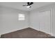 Cozy bedroom featuring a window and closet space at 1814 Eastway Dr, Charlotte, NC 28205
