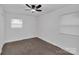 Simple bedroom featuring hardwood floors and two windows for natural light at 1814 Eastway Dr, Charlotte, NC 28205