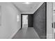 Clean hallway with dark accent wall at 1814 Eastway Dr, Charlotte, NC 28205
