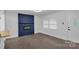 Clean, bright living room features sleek flooring, a modern fireplace, and lots of light at 1814 Eastway Dr, Charlotte, NC 28205