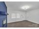 Bright living room with modern fireplace and great light exposure at 1814 Eastway Dr, Charlotte, NC 28205
