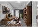 Stylized office with desk, rug, and bookcase at 1814 Eastway Dr, Charlotte, NC 28205