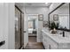 Bathroom featuring marble countertops and backsplash, and glass enclosed shower at 2074 Fordhill St, Rock Hill, SC 29732