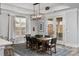 Dining room featuring a large dining table, modern chandelier, neutral walls, and access to the patio at 2074 Fordhill St, Rock Hill, SC 29732