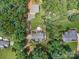 Overhead shot of a private home with pool, nestled amongst the lush canopy of surrounding trees at 217 Blossom Hill Rd, Lincolnton, NC 28092