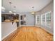 Charming dining area featuring hardwood floors, pendant lighting, and large windows at 217 Blossom Hill Rd, Lincolnton, NC 28092
