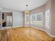 Open dining area filled with natural light, hardwood floors, and stylish lighting at 217 Blossom Hill Rd, Lincolnton, NC 28092
