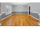 Spacious dining room featuring hardwood floors, natural light, and modern decor at 217 Blossom Hill Rd, Lincolnton, NC 28092