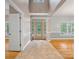 Welcoming foyer with tile and hardwood floors, glass front door, and abundant light at 217 Blossom Hill Rd, Lincolnton, NC 28092
