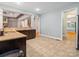 Bright kitchen showcasing granite countertops, tile floors, and an open layout at 217 Blossom Hill Rd, Lincolnton, NC 28092