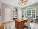 Cozy office featuring hardwood floors, natural light from a large window, built-in shelves and decorative rug at 217 Blossom Hill Rd, Lincolnton, NC 28092