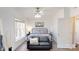 Cozy bedroom showcases a bed, sofa and window offering natural light and a view at 22970 Lake Tillery Rd, Albemarle, NC 28001