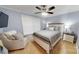Comfortable bedroom with a queen-size bed, chair, carpet and natural light from the window at 22970 Lake Tillery Rd, Albemarle, NC 28001