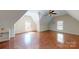 Versatile bonus room featuring hardwood floors, ample space, and natural lighting at 22970 Lake Tillery Rd, Albemarle, NC 28001