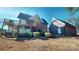 Charming brick home featuring a wooden deck and an detached garage, nestled in a serene wooded setting at 22970 Lake Tillery Rd, Albemarle, NC 28001