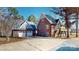 Charming two-story brick home with a two-car garage, driveway, and well-maintained lawn at 22970 Lake Tillery Rd, Albemarle, NC 28001