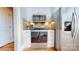 Modern kitchen equipped with stainless steel appliances, white cabinetry, and stylish backsplash at 22970 Lake Tillery Rd, Albemarle, NC 28001