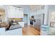 Bright kitchen with hardwood floors, white cabinetry, stainless steel appliances, and granite countertops at 22970 Lake Tillery Rd, Albemarle, NC 28001