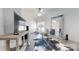 Stylish living room featuring tile floors, ceiling fan and large mirror creating an open and airy feel at 22970 Lake Tillery Rd, Albemarle, NC 28001